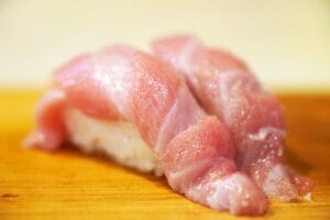 fatty fish on a wooden surface