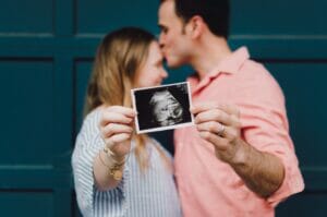 future parents with an ultrasound photo