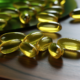 omega 3 capsules on a green table