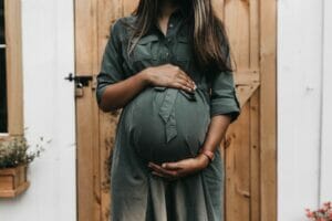 pregnant woman in a long dress