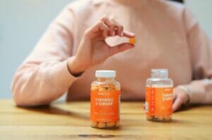 two vitamin bottles on a table