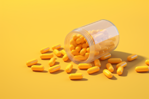 creatine capsules on a yellow table